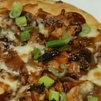 Bbq Chicken Flatbread · Grilled bbq chicken, caramelized onions, diced bacon and mozzarella cheese.