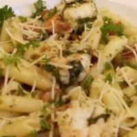 Pesto Shrimp Pasta · Jumbo shrimp with diced tomatoes and baby arugula sautéed  in extra virgin olive oil finishe...