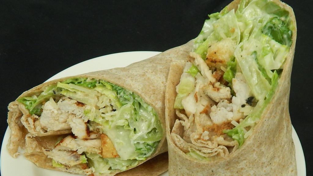 Chicken Caesar Wrap · Grilled chicken crisp romaine lettuce tossed in caesar dressing, parmesan cheese and garlic croutons.
