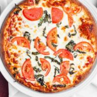 Pizza Margherita · Fresh basil, fresh garlic, tomatoes, feta cheese.