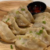 Dumpling (8 Pcs) · Pan Fried Dumpling stuffed with pork.