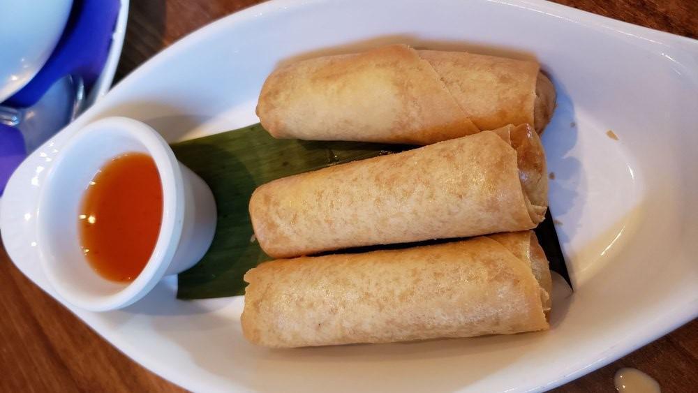 Spring Rolls · **This item cannot be made Gluten-free**. Crispy deep-fried spring rolls stuffed with vermicelli noodle, cabbage, taro root, carrot, celery served with pineapple sauce (3)