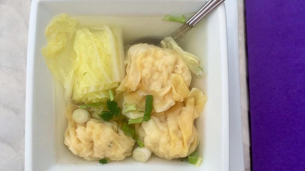 Wonton Soup · Vegetable broth, shrimp and chicken stuffed wonton, Napa cabbage, fried garlic, scallion, cilantro