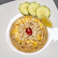 Vegan Crab Fried Rice · Mock crab meat, jasmine rice, carrot, green peas, corn, scallion, onion