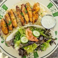 Grilled Chicken Plate · Grilled boneless Chicken breast  on bed of rice and Mediterranean salad and Tzatziki sauce