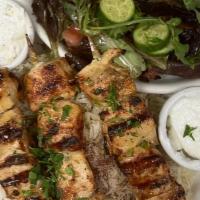 Chicken Kabob Plate · 3 skewers on bed of rice with Mediterranean salad