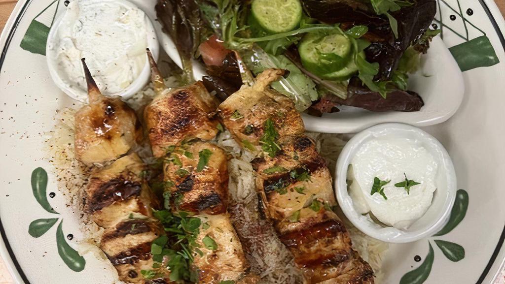 Chicken Kabob Plate · 3 skewers on bed of rice with Mediterranean salad