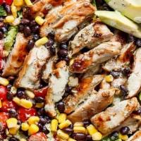 Southwest Chicken Salad · Lightly seasoned chicken breast strips atop a bed of fresh greens, tomatoes, black olives, c...