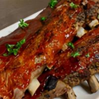 Bbq Baby Back Ribs Full · The tenderest baby ribs, hickory smoked and covered with RJ's own BBQ sauce