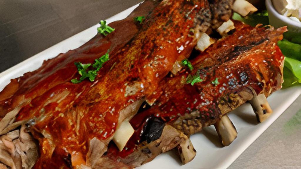 Bbq Babyback Ribs Half · The tenderest baby ribs, hickory smoked and covered with RJ's own BBQ sauce.
