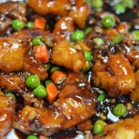 Honey Crispy Chicken · Chicken breast batter deep-fried with peas and carrot in sweet brown sauce.