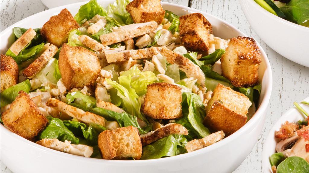 Chicken Caesar · The Chicken Caesar salad comes with fresh baked croutons, lettuce mix with grilled chicken, parmesan cheese.
