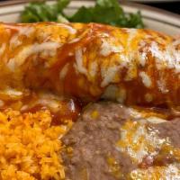 Burrito Banado · Your choice of ground beef, shredded beef, chicken, red or green chili con carne smothered w...