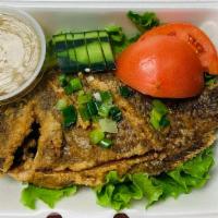 Tilapia Chien Gion · Whole crispy tilapia with ginger sauce. Served w. a small white rice