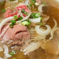 Pho Xe Lura · Extra big bowl combination of half-done beef filet, brisket, beef tendon, and beef tripe.
