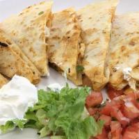 Steak Quesadilla · Chopped steak with cheese served with salsa and sour cream. Served with rice, beans, pico de...