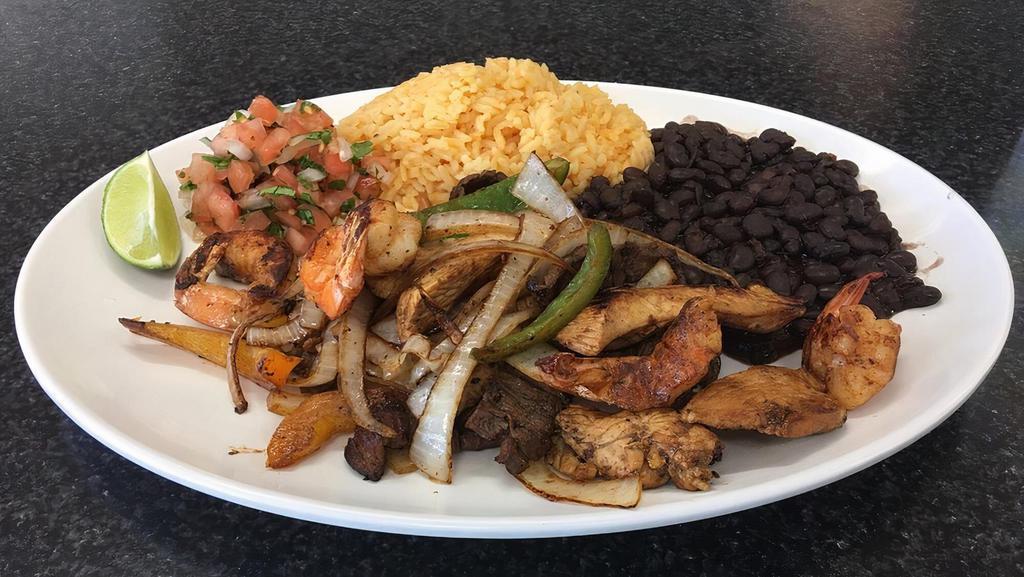 Fajita Mixta · Chopped steak, shrimp and chicken with onions and peppers. Served with rice, beans, pico de gallo and two warmed tortillas.