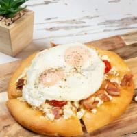 Breakfast Pizza. · Focaccia flats, sunny side up eggs, bacon, crumbled feta, and cherry tomatoes