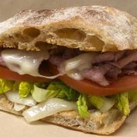Ham On Ciabatta. · Black Forest Ham, Emmentaler Cheese, Lettuce, Tomatoes, and Caramelized Onions