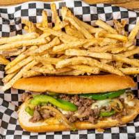 Philly Cheesesteak · Sliced steak topped with sautéed onions, belt peppers, and melted provolone cheese on a hoag...