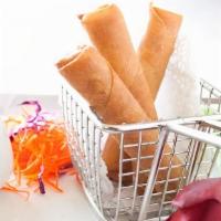 Crispy Spring Rolls · Cabbage, carrots, cellophane noodles and shiitake mushrooms served with sweet chili sauce.