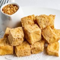 Tofu Squares · Fried fresh tofu with sweet chili sauce and crushed peanuts.