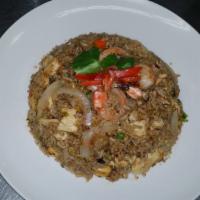 Thai Fried Rice · Choice of chicken, beef, pork, add shrimp. Stir-fried rice with eggs, garlic, peas, carrots,...