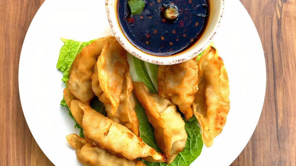 8 Pork Dumplings Fried · Our house seasoned pork dumplings deep fried and served with a cup of spicy garlic sauce.