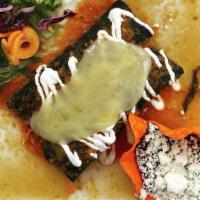 Enchiladas Suizas (Sold Out) · Two blue corn enchiladas stuffed with shredded chicken. Topped with huasteca red sauce, ques...