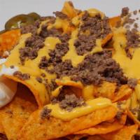 Nacho Jr. · Doritos chips topped with  nacho cheese, jalapenos and sour cream. with your choice of meat.