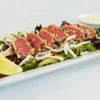 Ahi Tuna Salad · Mixed greens tossed in our homemade sesame ginger dressing with diced red peppers, shredded ...
