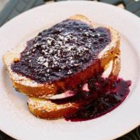 Stuffed French Toast · Our Artisanal brioche French toast stuffed with sweet Mascarpone cheese and topped with a ho...