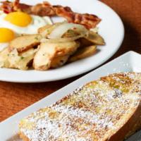 Eggstravaganza · Our classic dish: two any-style eggs, two slices of brioche French toast with a choice of ha...