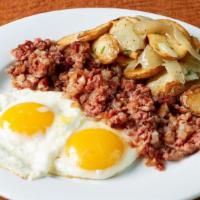 Eggwhat? · Corned beef hash, two eggs any style, served with toast and our Lyonnaise-style potatoes. 

...