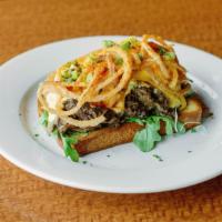 Braised Short Rib Benedict · Grilled brioche bread topped with fresh arugula, tender six hour braised angus short rib and...
