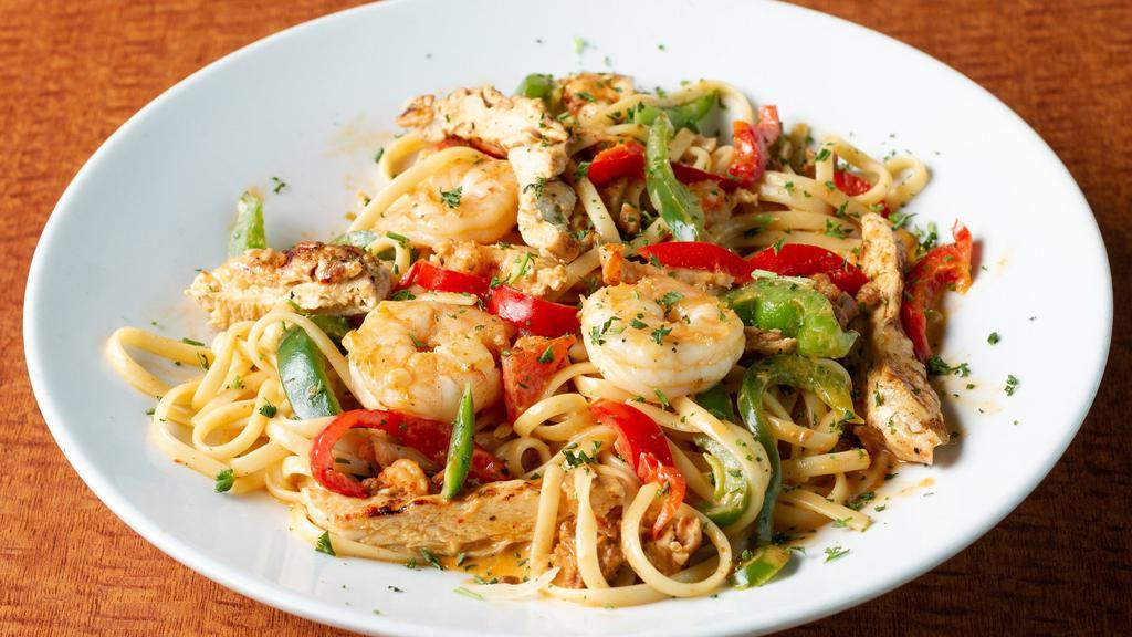 J”Egg”Balaya Pasta · Smothered in creamy Cajun sauce with grilled chicken, red and green peppers, chorizo sausage, crawfish tails, and shrimp.