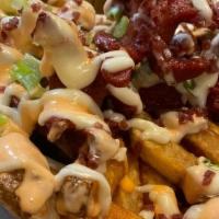 Salchipapas · Lightly fried hot dog florets on a bed of our house-cut French fries, with crazy sauce, garl...