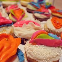 Retro Jay 4 Pack · Delicious 4 pack of vanilla cupcakes topped with cream cheese frosting with a variety of Ret...