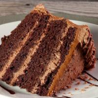 Chocolate Fudge Cake · R.l.'s best! Chelo's famous four-tiered rich chocolate cake layered with chocolate mousse an...