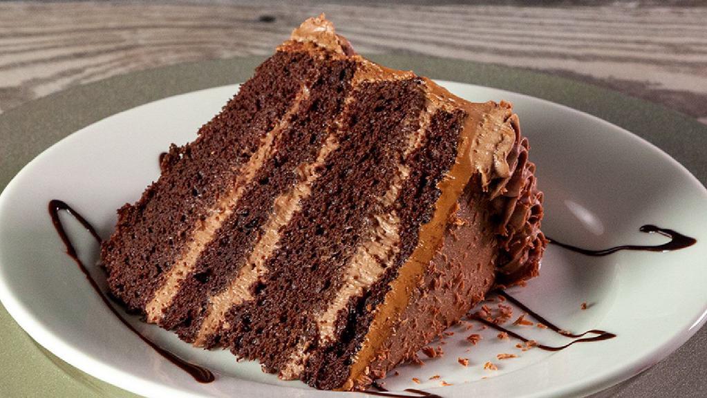Chocolate Fudge Cake · R.l.'s best! Chelo's famous four-tiered rich chocolate cake layered with chocolate mousse and glazed with chocolate frosting.