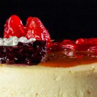 Cheesecake · Rich and creamy New York style cheesecake. Choose your topping - strawberry, blueberry, cher...
