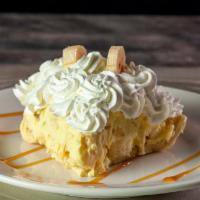 Banana Cream Pie · Fresh bananas mixed into a rich banana mousse, folded into a golden crust and piled high wit...
