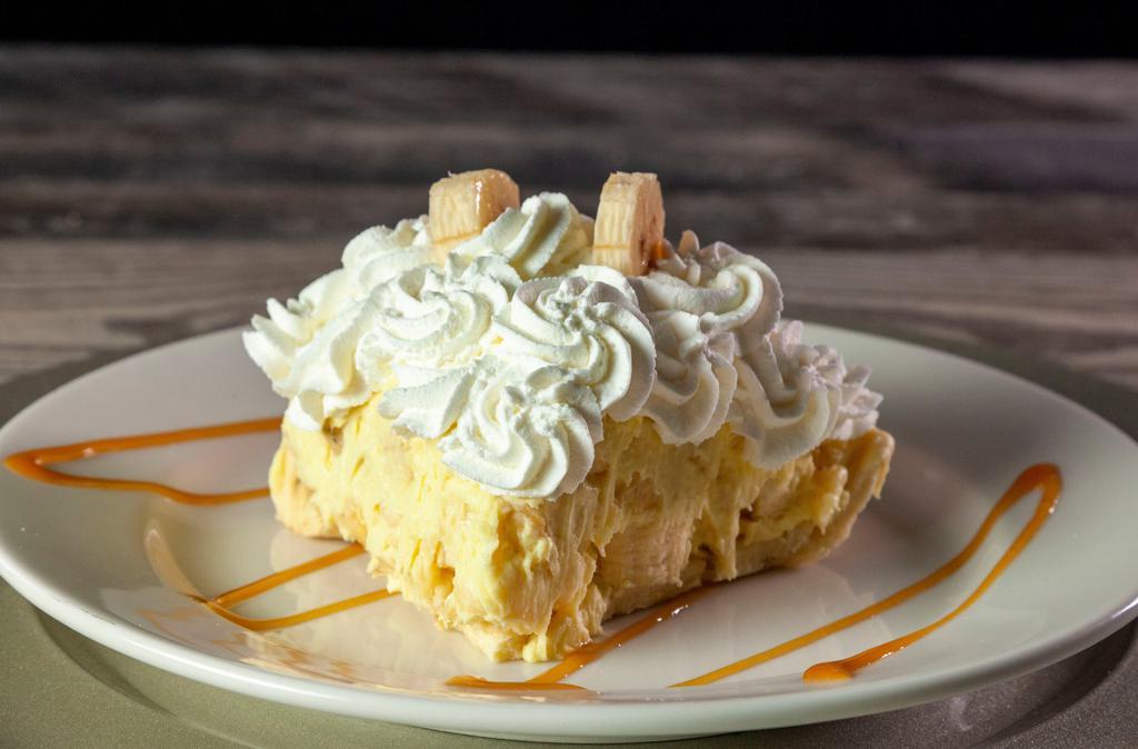 Banana Cream Pie · Fresh bananas mixed into a rich banana mousse, folded into a golden crust and piled high with real whipped cream