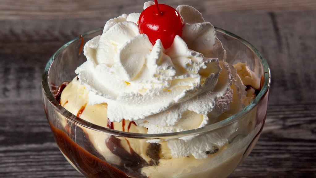 Hot Fudge Sundae · A generous portion of French vanilla ice cream with your choice of chocolate or butterscotch toppings. Topped with real whipped cream, walnuts and a cherry.