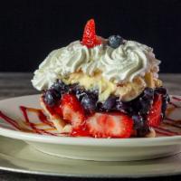 Banana Berry Pie · Our famous creation! Fresh blueberries and strawberries tossed in our fruit glaze, topped wi...