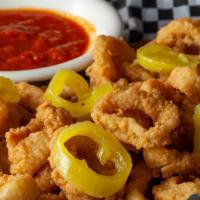 Calamari · Our lightly breaded calamari rings fried golden brown and served with marinara sauce and pep...