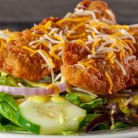 Chicken Finger Salad · A large garden salad topped with chicken tenders and shredded cheddar and Monterey jack chee...