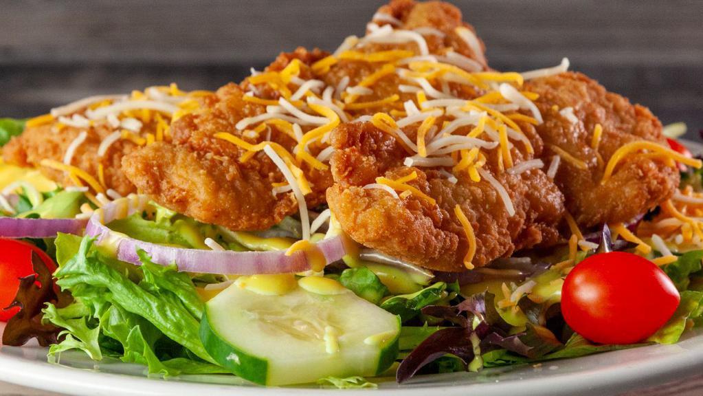 Chicken Finger Salad · A large garden salad topped with chicken tenders and shredded cheddar and Monterey jack cheese. Served with your choice of dressing.