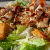 Chelo'S Chicken Caesar Salad · Fresh cut romaine lettuce tossed in our classic Caesar dressing with croutons, shredded Roma...