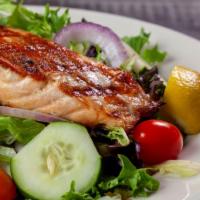 Grilled Salmon Salad · Fresh mixed greens with red onions, cucumbers and grape tomatoes. Topped with grilled Norweg...
